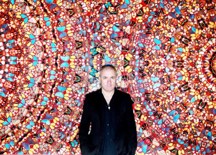 Damien Hirst in front of his artwork "I Am Become Death, Shatterer of Worlds" which sold at Christies for 2,169,250
