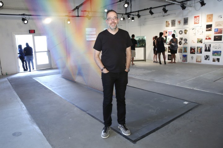 MIAMI, FL - DECEMBER 03: Artist Gabriel Dawe poses for a portrait in front of his artwork 'Plexus 32' at The Dean Collection X BACARDI No Commission Art Fair Day 1 on December 3, 2015 in Miami, Florida. (Photo by Monica Schipper/Getty Images for Bacardi)